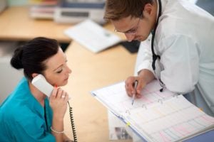 Medical Assistant Looks At Schedule