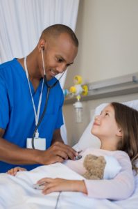 Nurse examines young girl