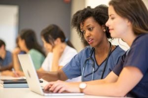 Nursing students learning on computers